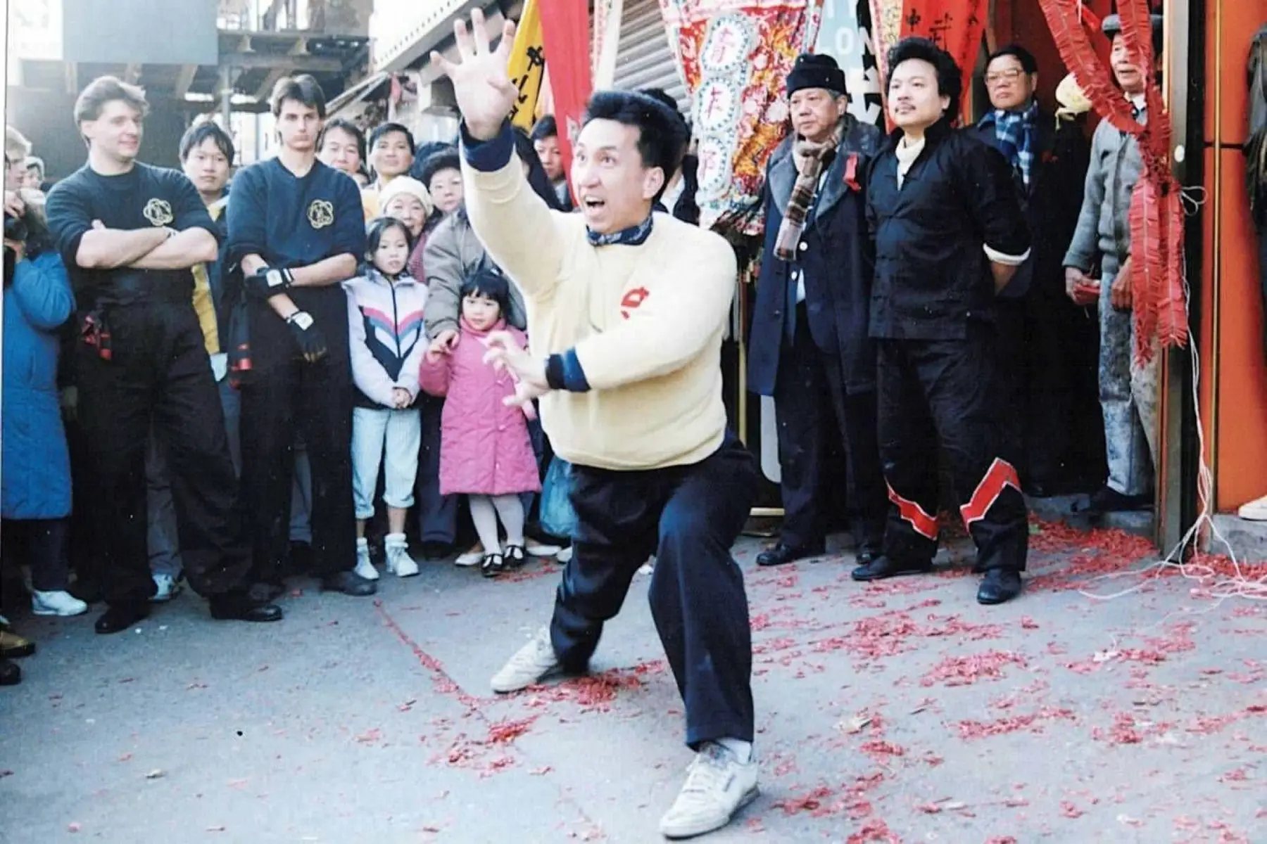A public martial arts demonstration with Sifu Tony Lau watching from the doorway